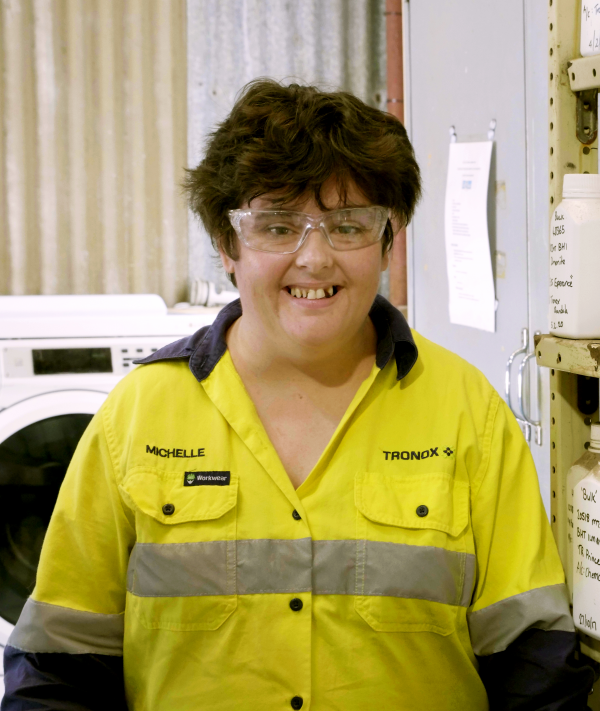 Michelle at her work, wearing thr fluro uniform