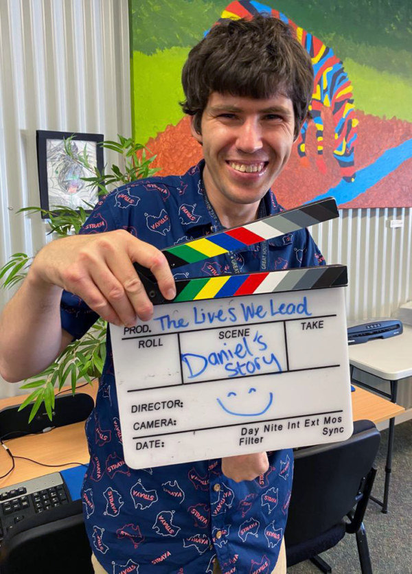 Portrait of Daniel with clapper board