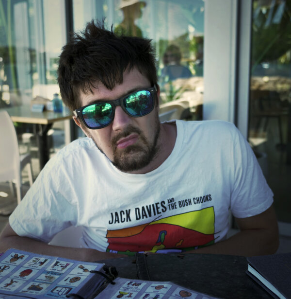 Paul sitting in a cafe. 