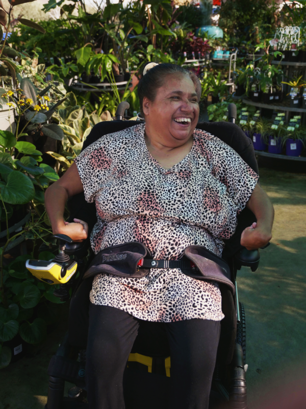 Tammy laughing in garden shop